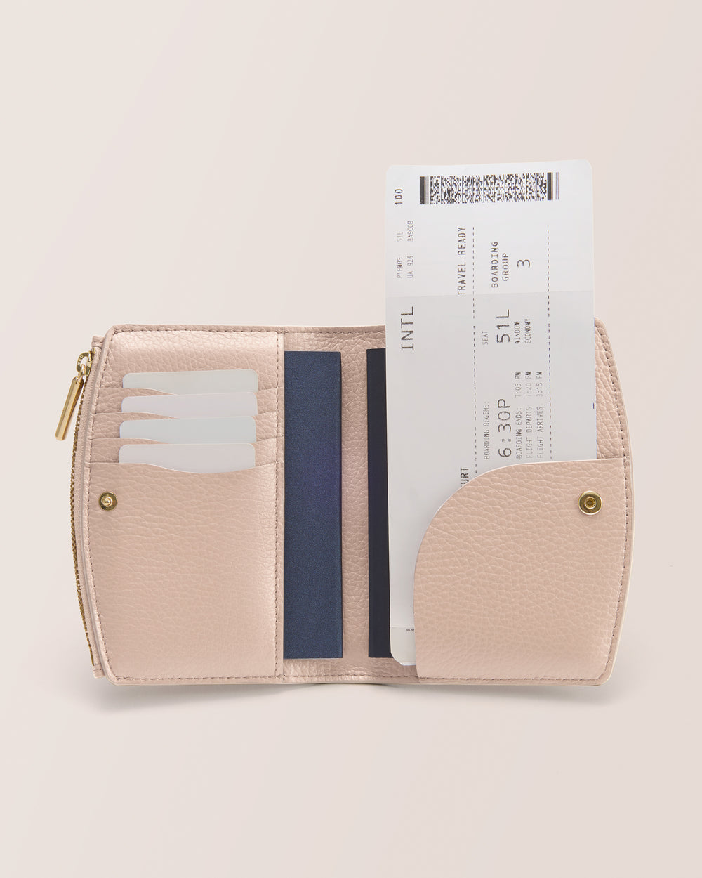 Open wallet holding cards and a boarding pass