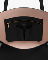 Open bag with pockets and a zipper inside.