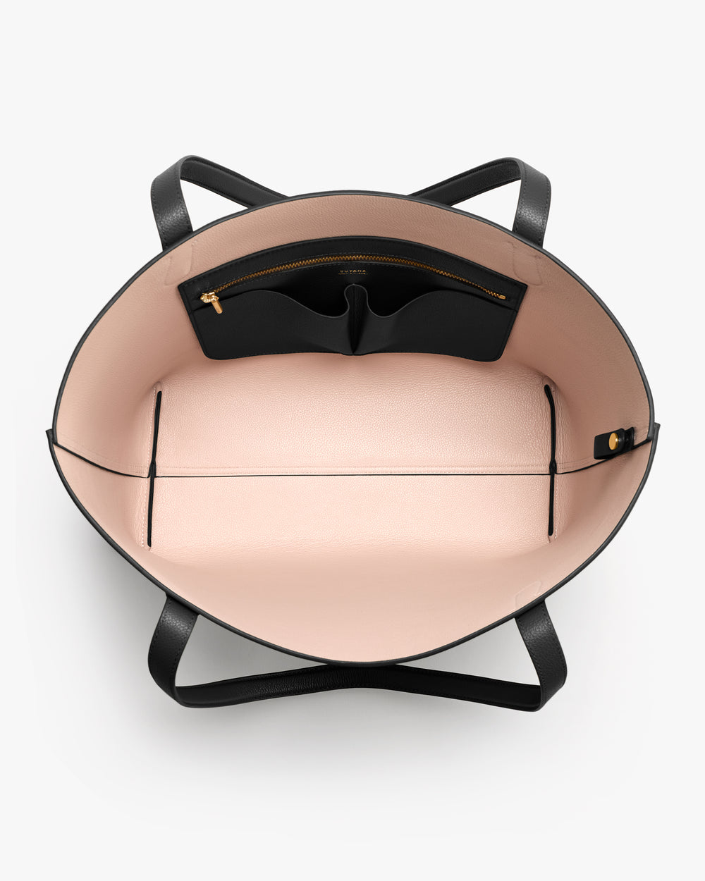 Open handbag with interior pockets and zippers visible from above.