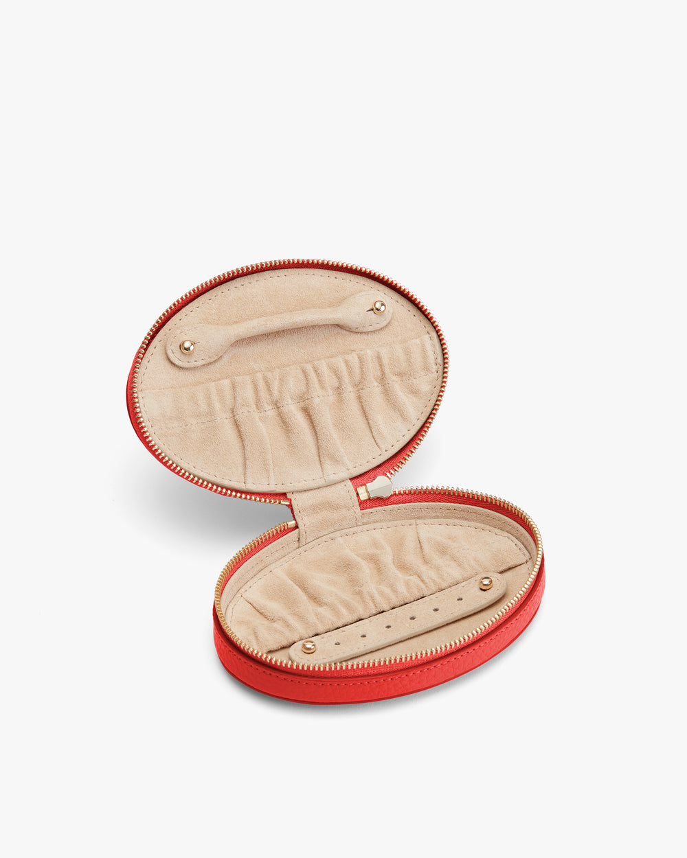 Round zippered jewelry case with multiple compartments inside.