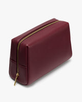 Rectangular leather pouch with a zippered top.