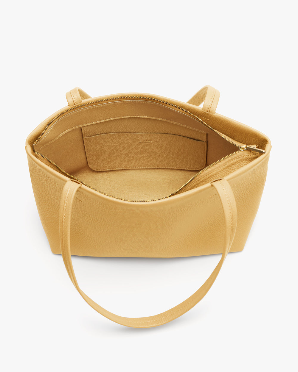 Open tote bag with short handles and zipper pocket inside.