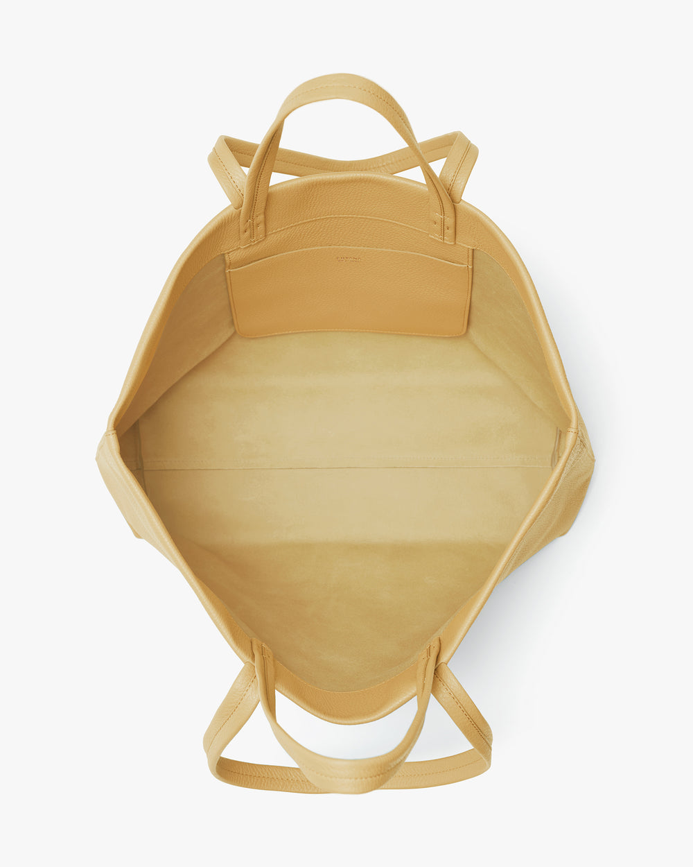 Looking down into an open tote bag with handles.