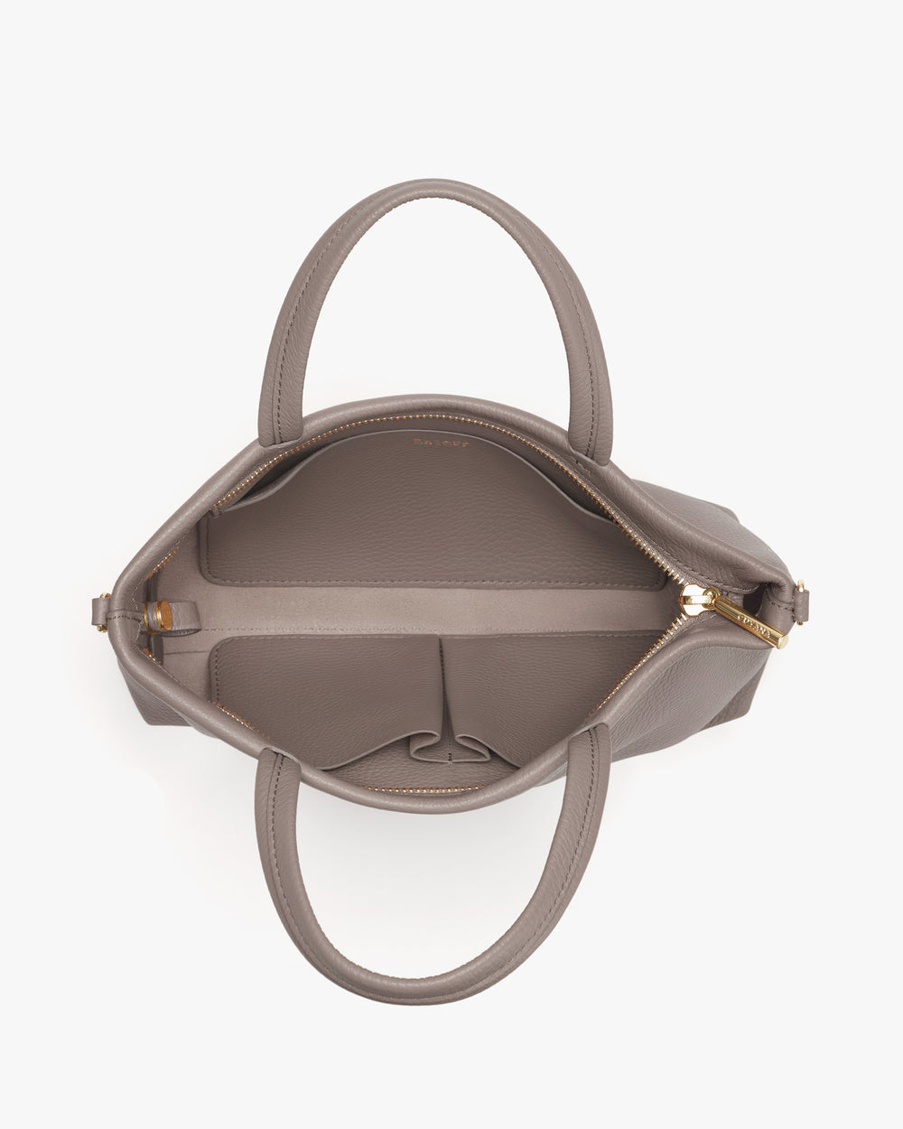 Open handbag with two handles and multiple compartments viewed from above.