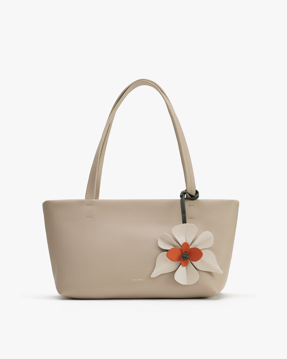 Handbag with flower detail on the front and two handles.