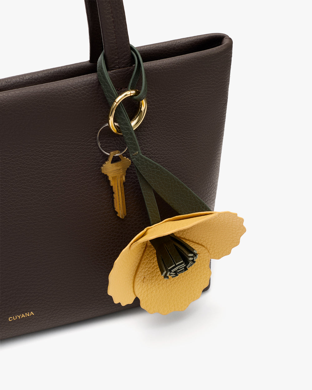 Tote bag with keychain featuring a flower and key.