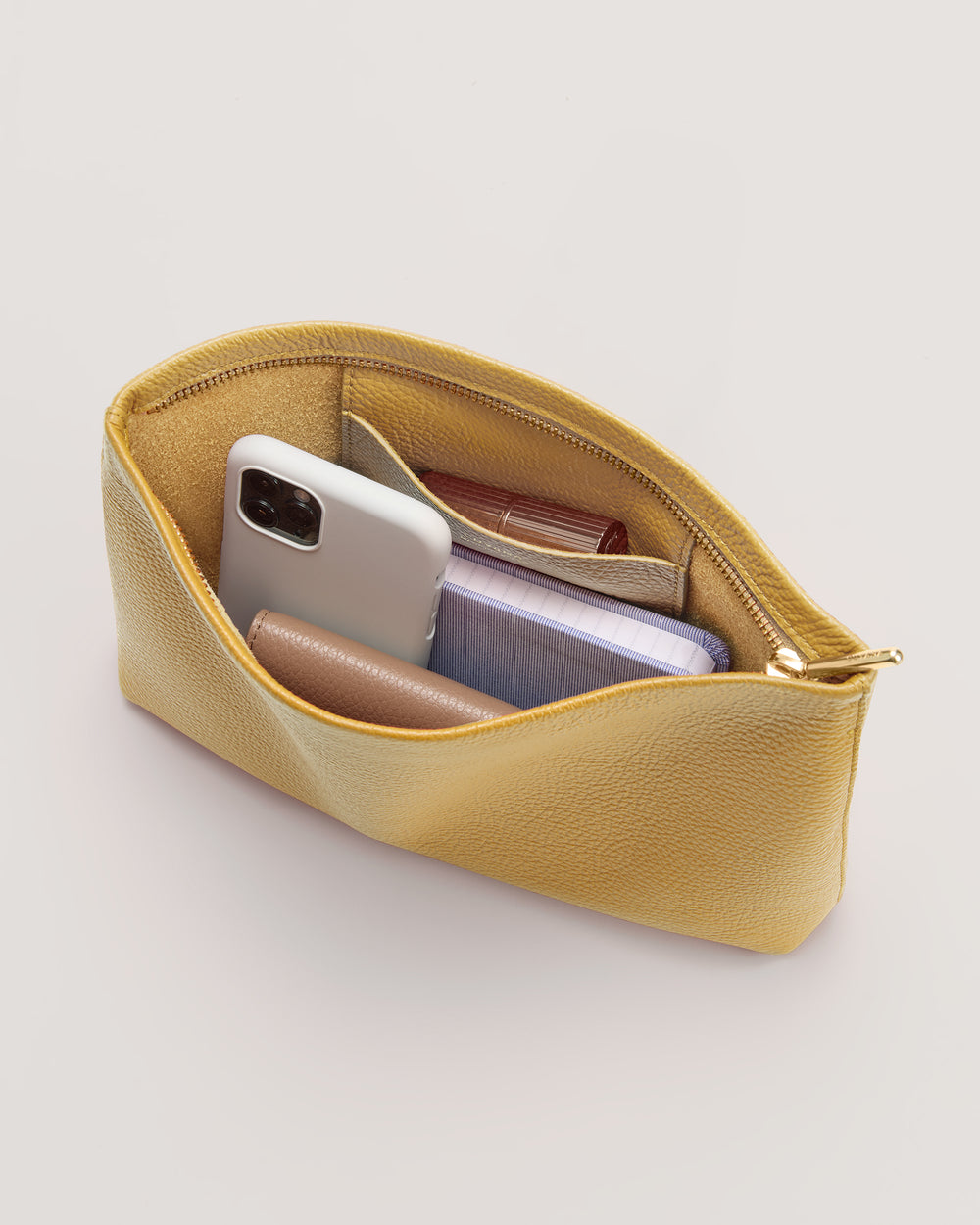 Open pouch with phone, book, and small items inside.
