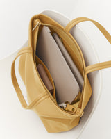 Open travel bag with organized contents inside.