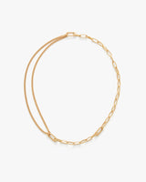Two intertwined chains forming a necklace.