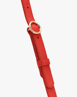Adjustable bag strap with metal clasp and holes in strap to adjust to preference.