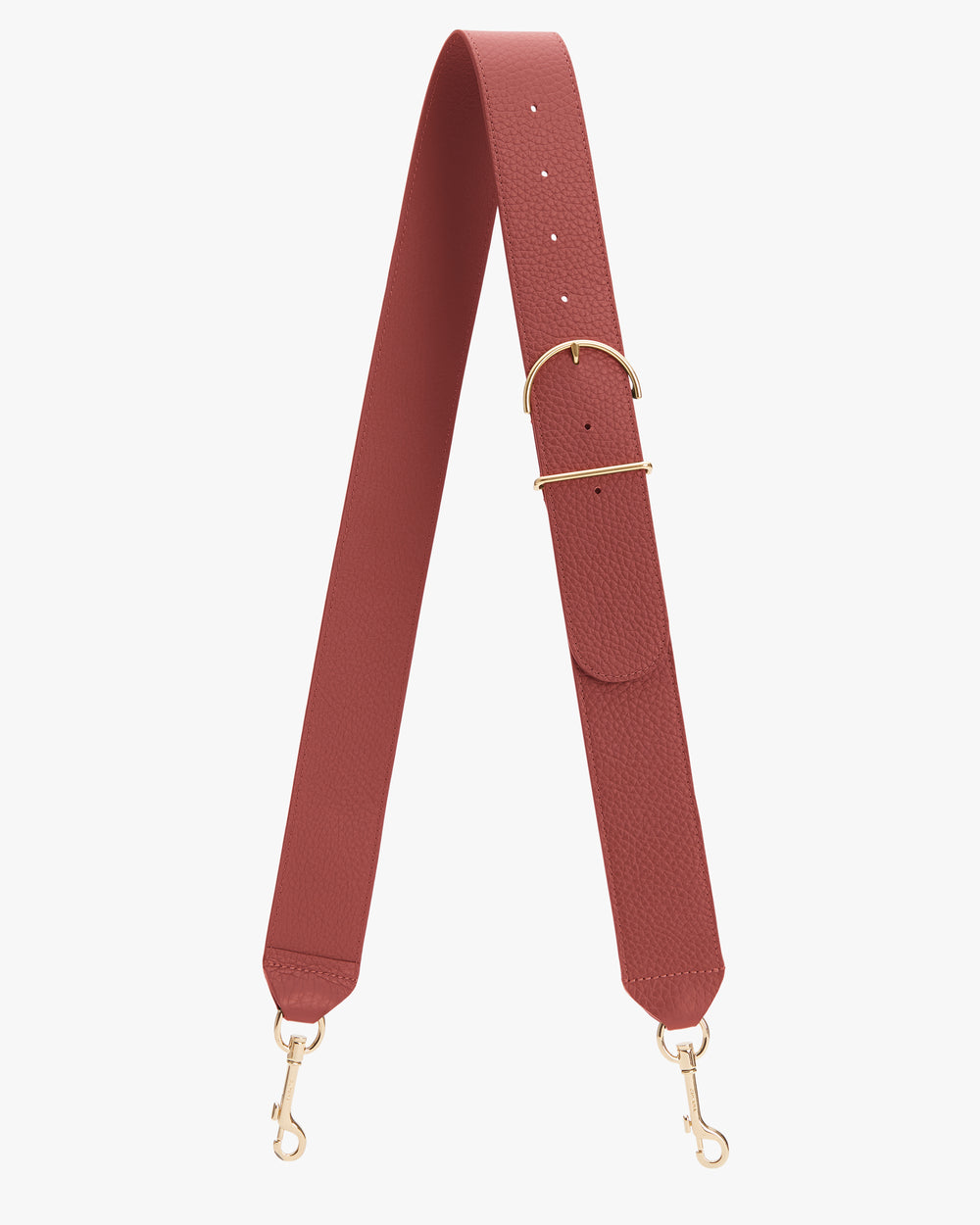 Bag strap with gold clasps and adjustable buckle lying flat.