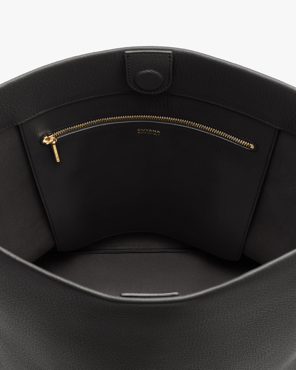 Open bag displaying a zippered pocket inside.