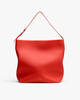 Large tote bag with a single strap and small logo on the front.