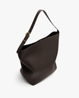 Shoulder bag with adjustable strap and open top.