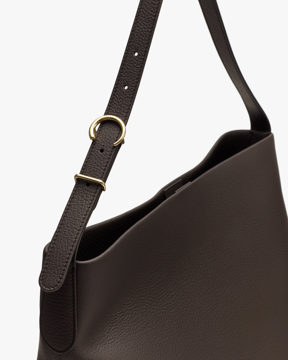 Shoulder bag with an adjustable strap and gold ring detail.