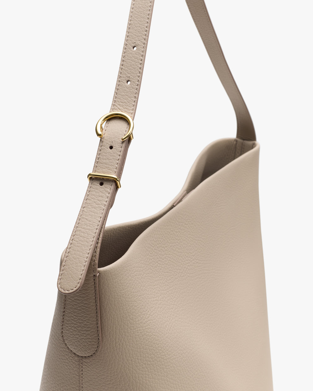 Simple shoulder bag with strap and metal buckle detailing.