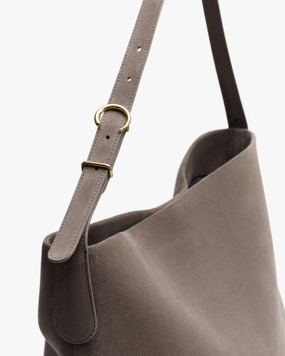 Shoulder bag with adjustable strap and gold buckle.