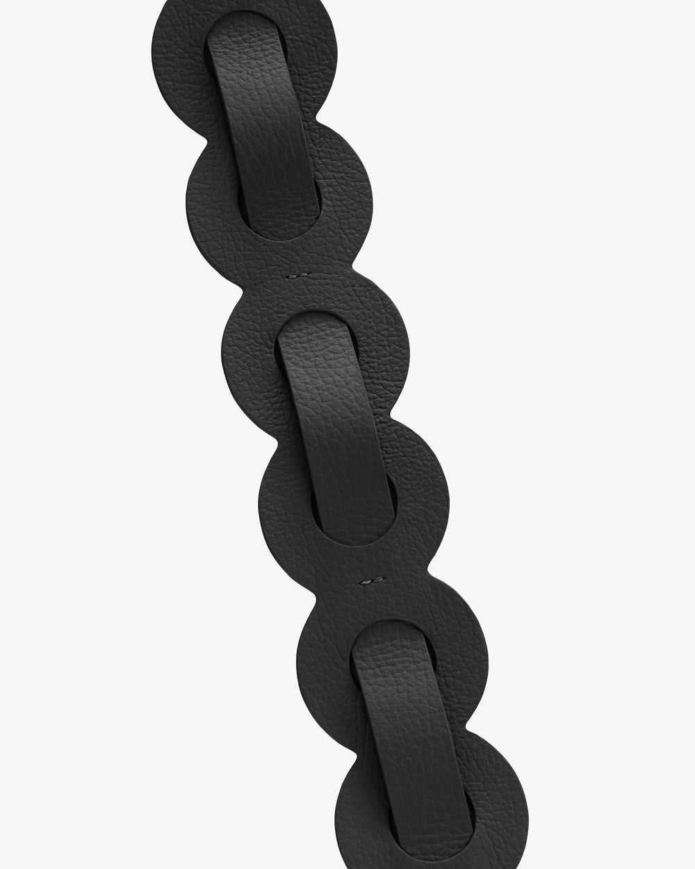 Close-up of interlocking looped leather strap design.