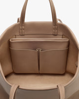 Open travel bag with inside pockets visible.