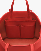 Open travel bag with interior pocket compartment.