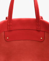 Bag with two handles and two small studs.