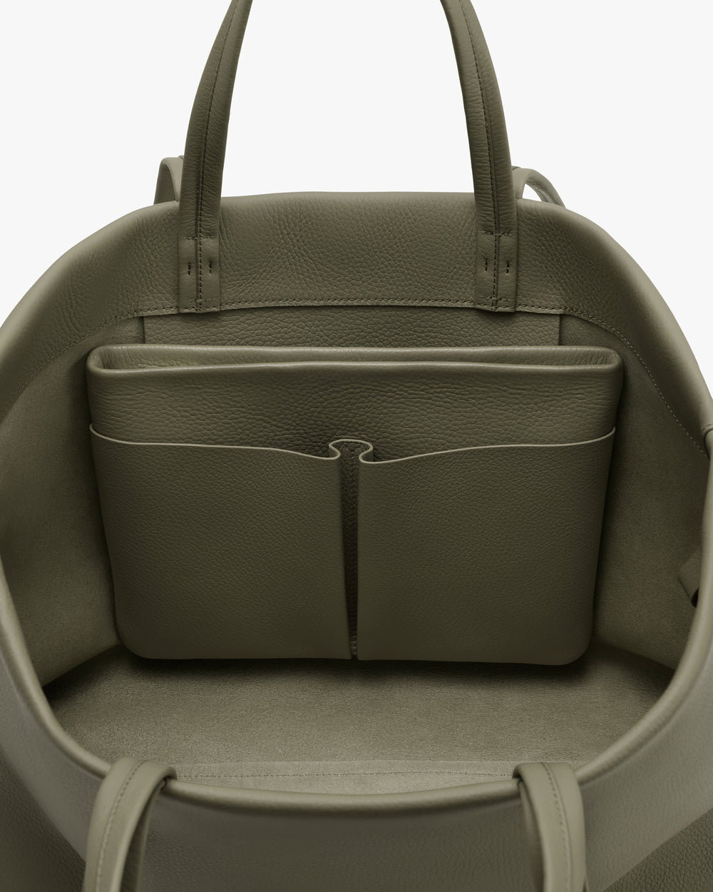 Open travel bag with interior pockets and handles.