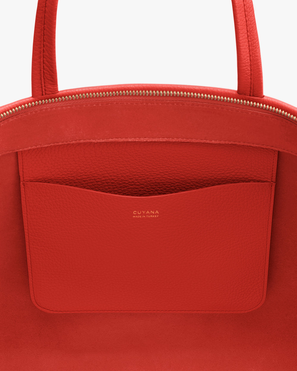 Tote bag with a zippered top and external pocket.