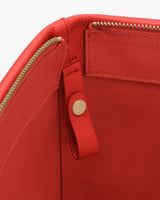 Open bag with zipper and snap strap inside.