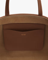 Open handbag with visible interior pocket and zipper closure.