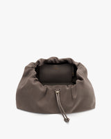 Drawstring pouch with a small purse inside.