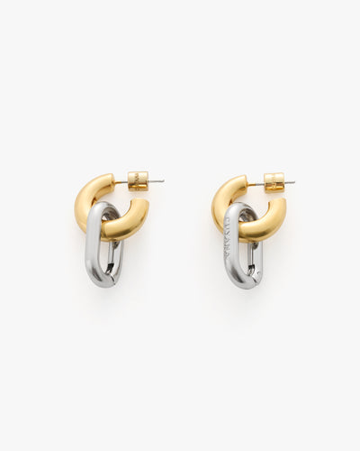 Two interlocking metal hoop earrings with a sleek finish.