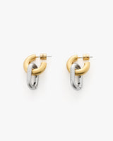 Two interlocking metal hoop earrings with a sleek finish.
