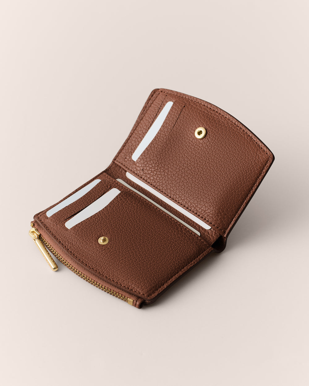 Open wallet with multiple card slots and a zipper compartment.