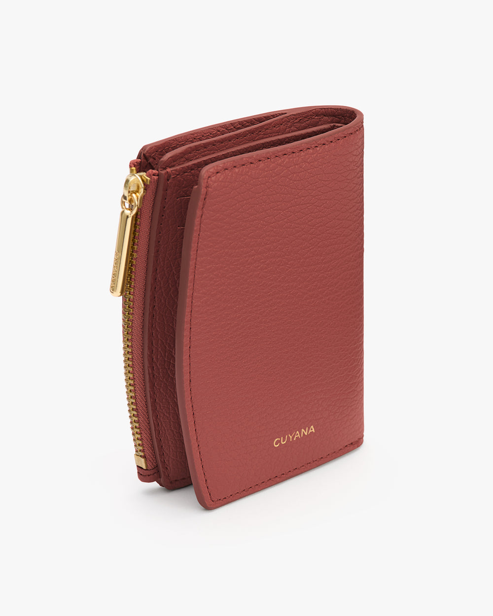 Small wallet with zippered compartment standing upright.