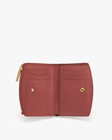 Open wallet with card slots and zipper.