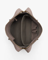 Open travel bag with zipper and multiple compartments seen from above.
