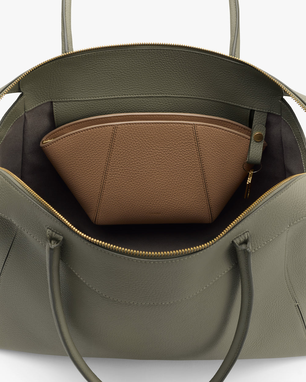 Open travel bag with a smaller pouch inside.
