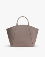 Tote bag with curved handles on white background.