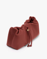 Soft handbag with a drawstring closure.