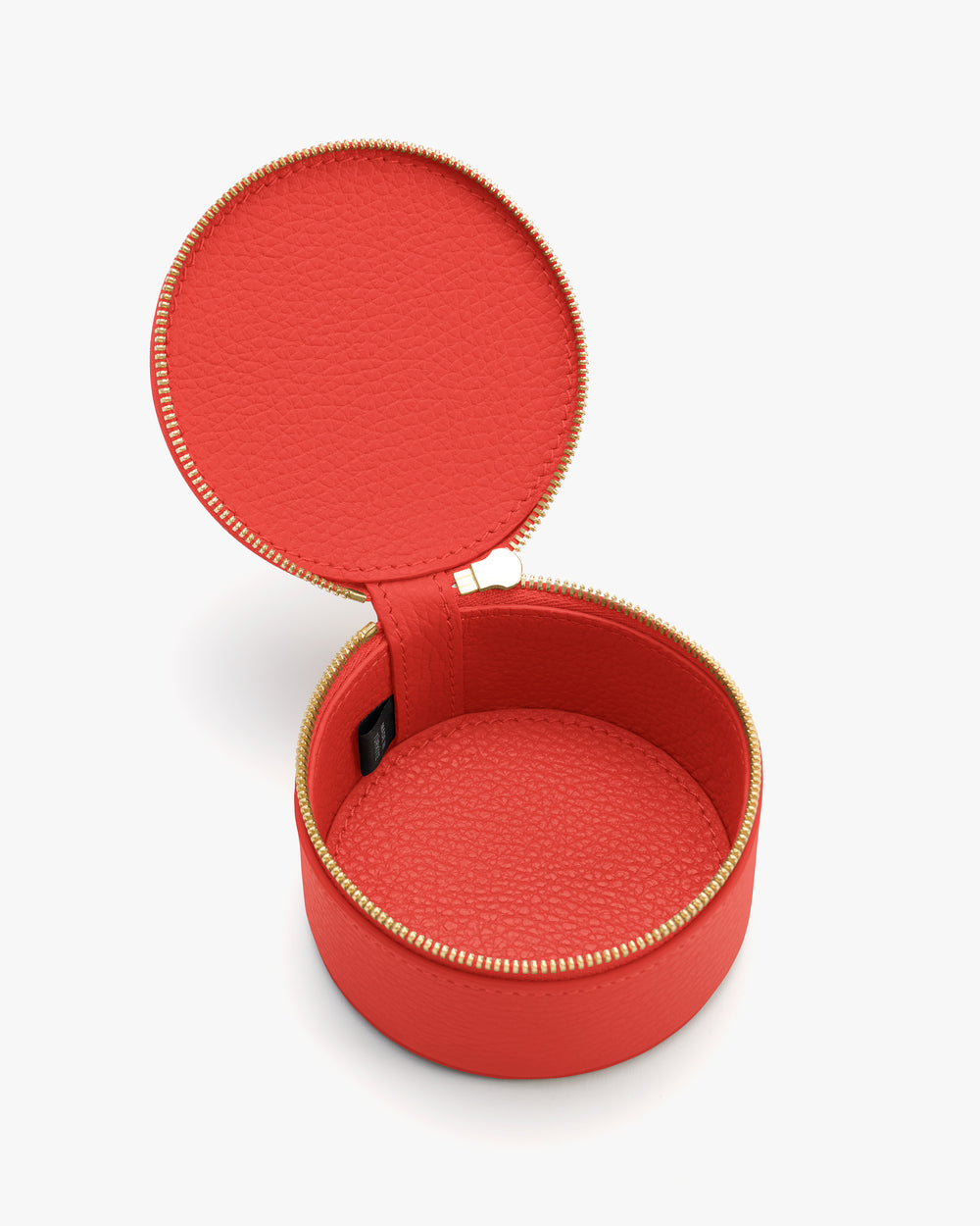 Round textured zippered case open to show interior.