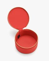 Round textured zippered case open to show interior.