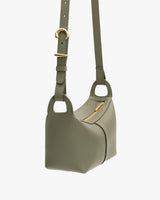 Shoulder bag with an adjustable strap and a zipper closure.