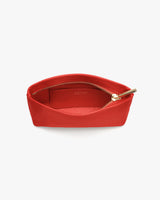 Open zippered pouch with visible interior pocket and a zipper pull.