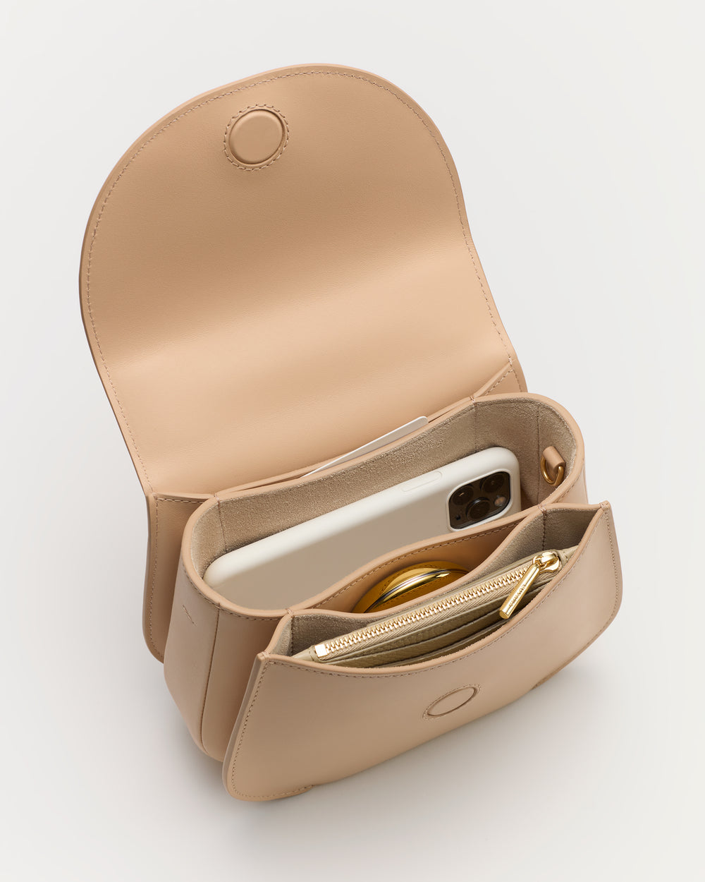 Open handbag with phone and items inside