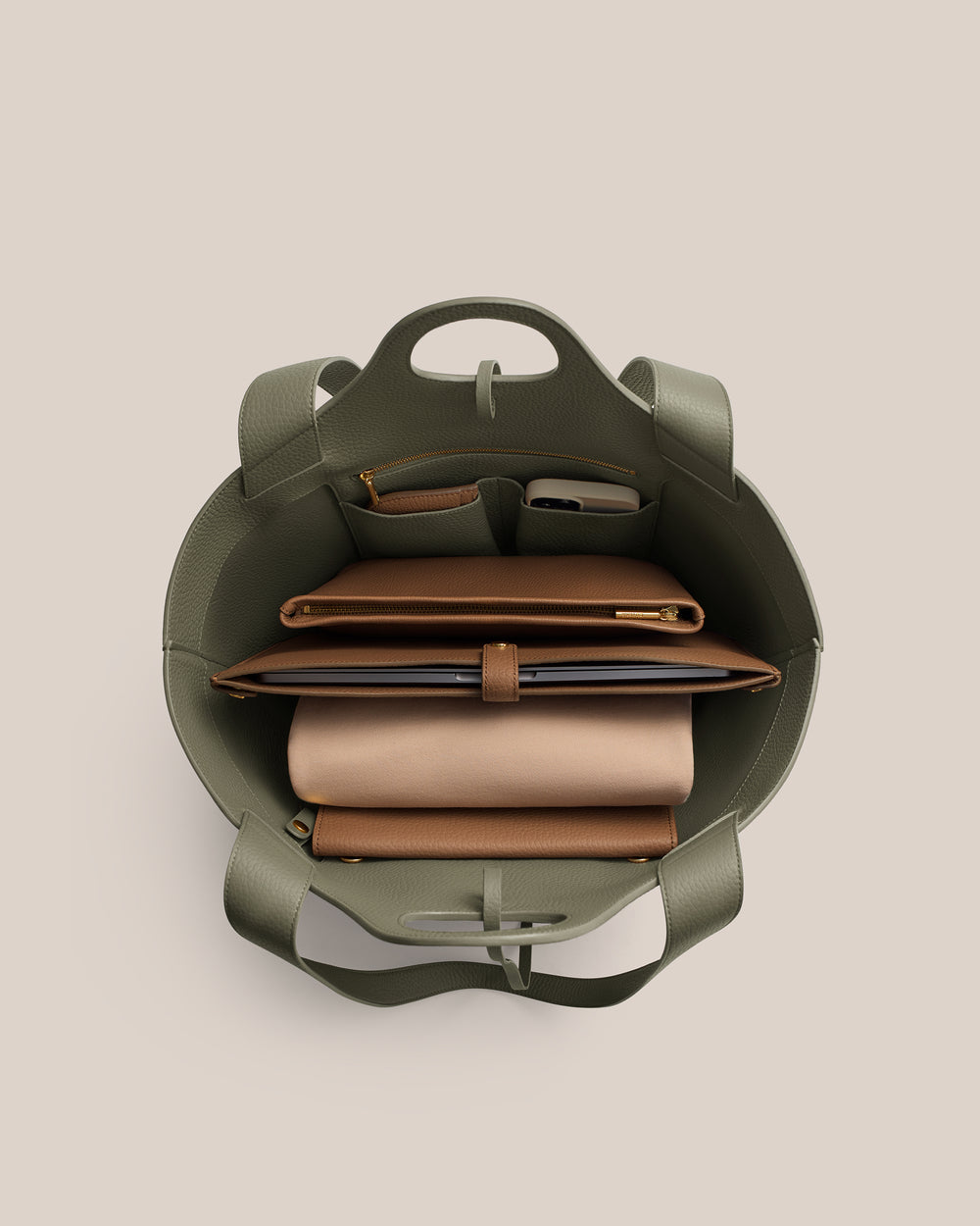 Open bag with organized compartments holding items inside.