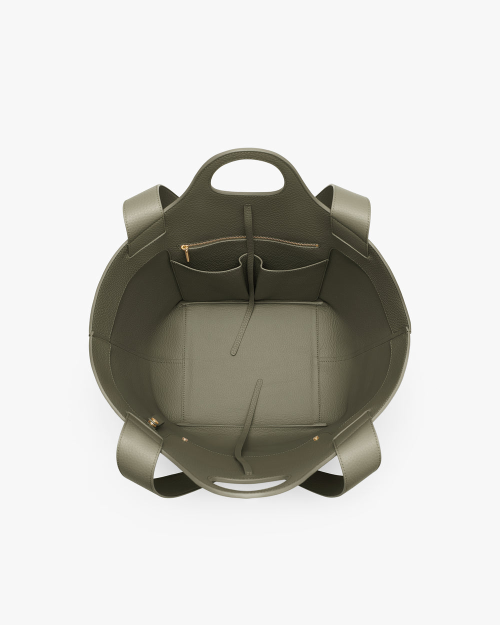 Open handbag with pockets and handles viewed from above.