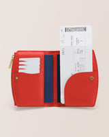 Open wallet with cards and a boarding pass inside.