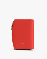 Small leather wallet with a zippered edge and brand name on front.