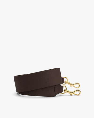 Bag strap with gold clasps on both ends.