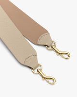 Bag strap with two metal clasps.